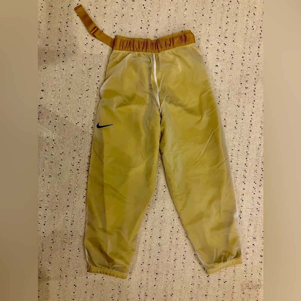 Yellow gold Nike joggers